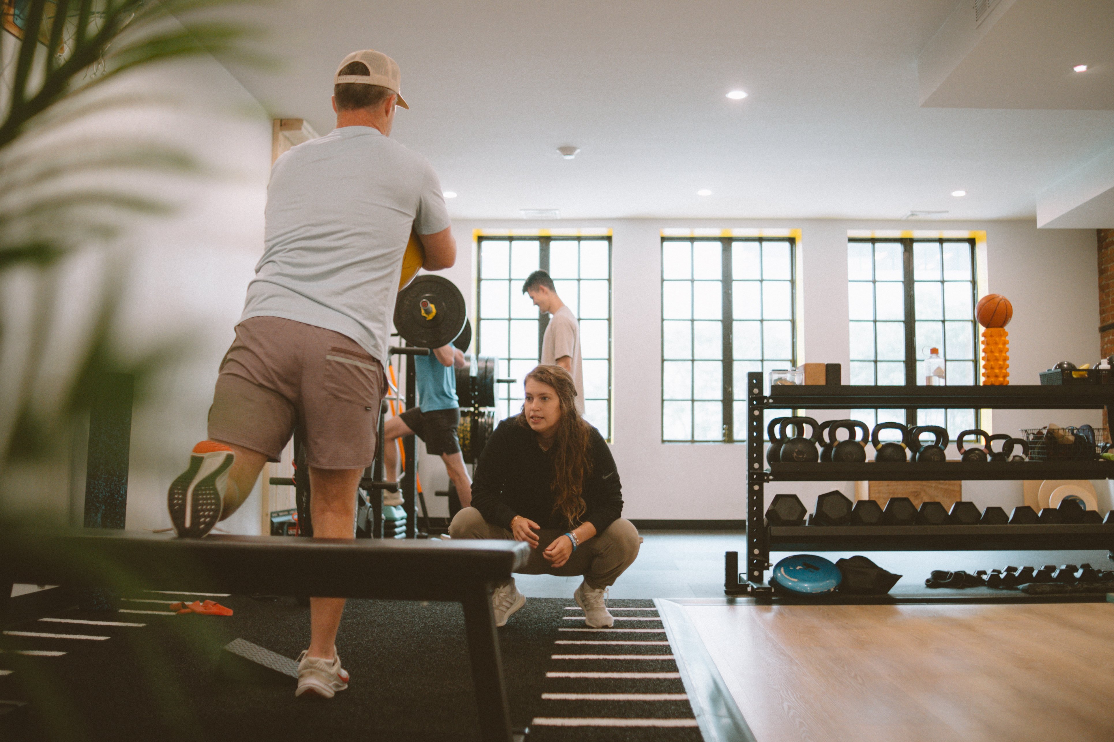 Patient completing a movement assessment with a physical therapist